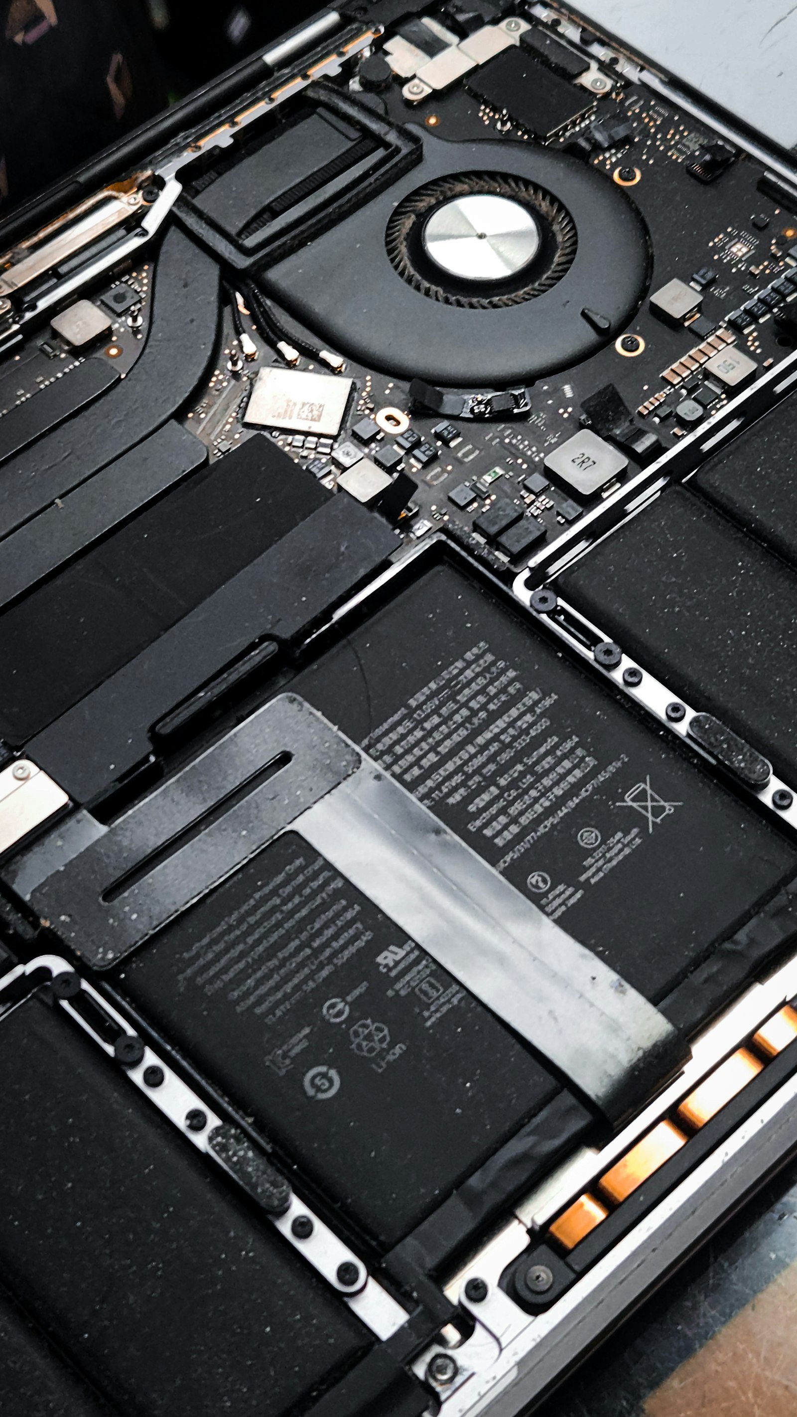 Close-up of laptop internal components during technical diagnostics.